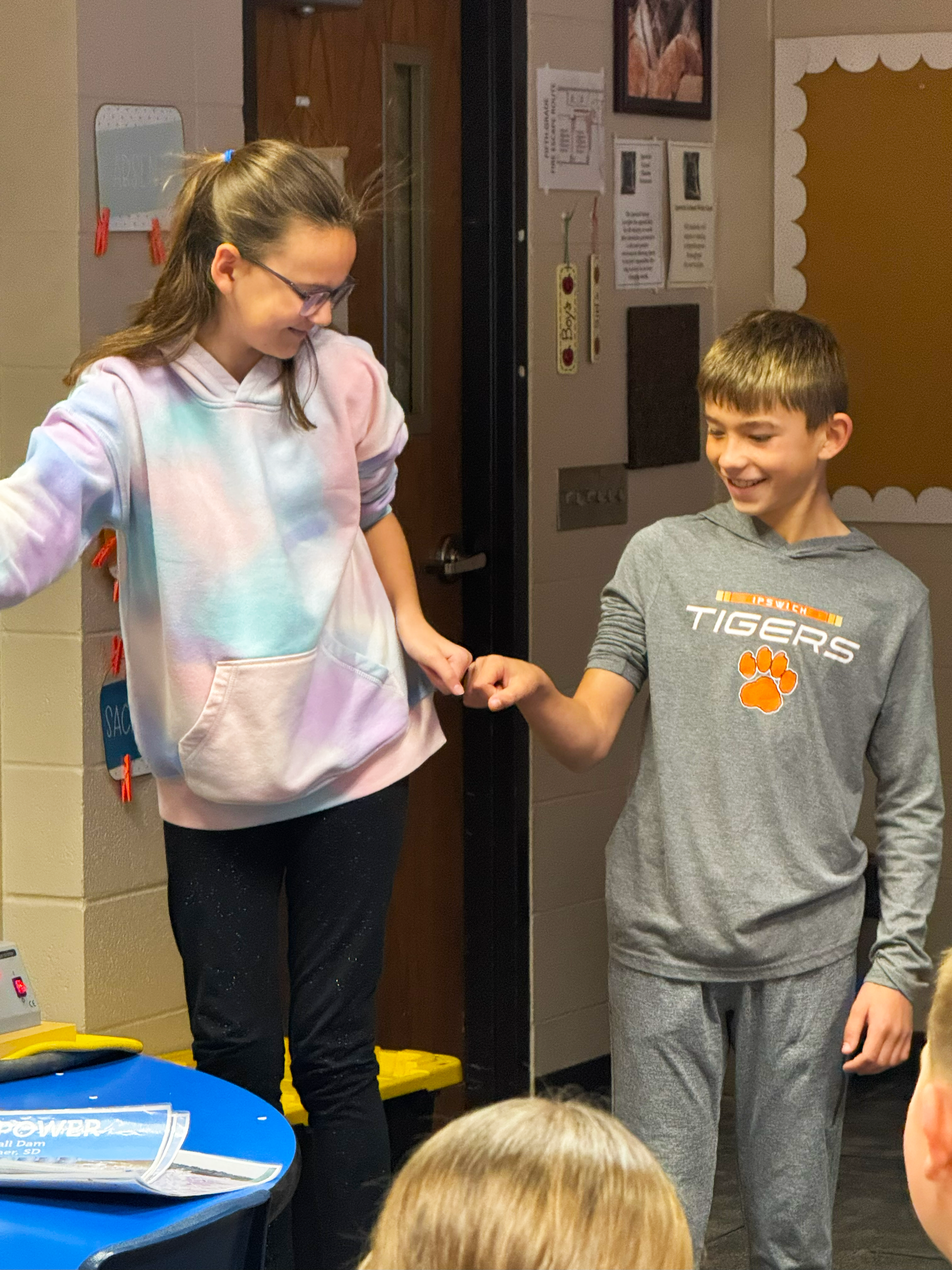Two students with testing the Van de Graaff generator